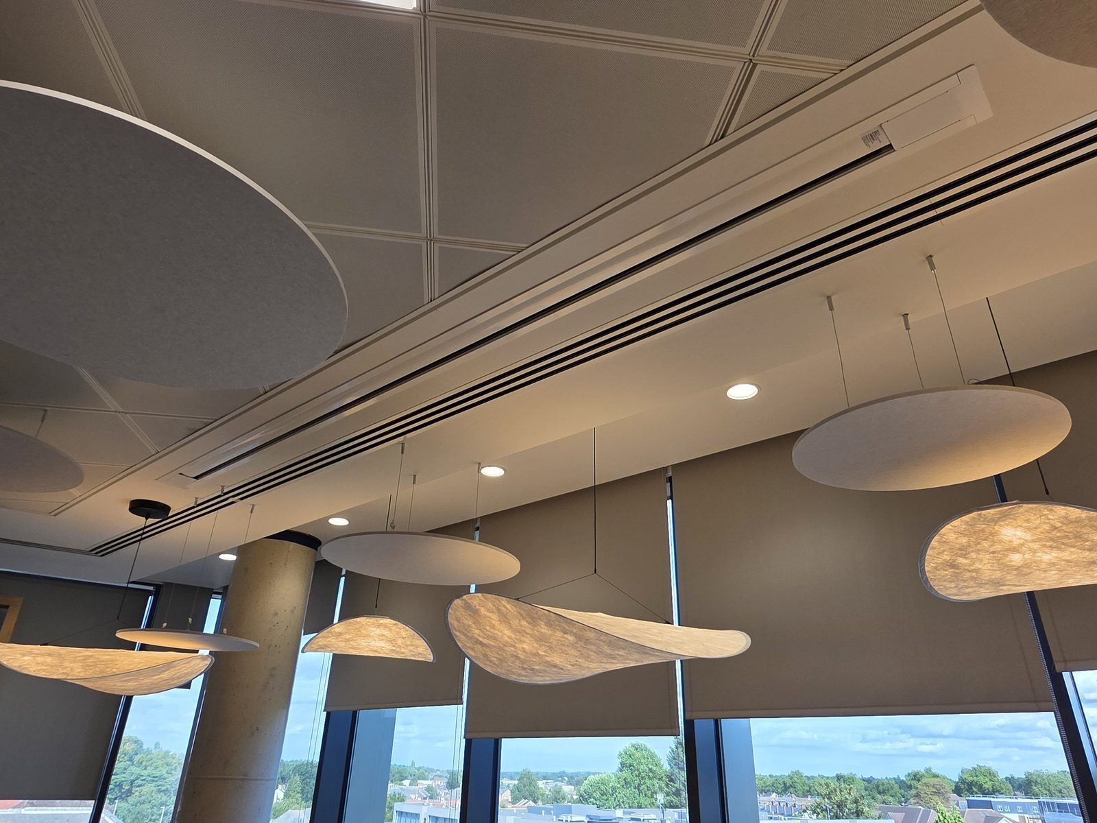 Feature ceiling lights and downlights in an office breakout